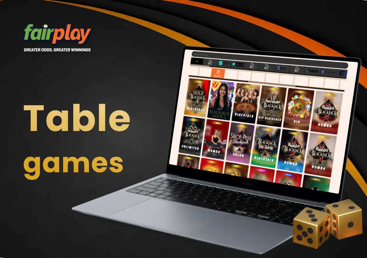 Laptop displaying fairplay table games selection with dice placed beside the screen.